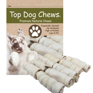 May include: A bag of Top Dog Chews premium natural dog chews. The bag features a cartoon dog and the text "Organically Sourced, No-Hormones, High in Protein, Low in Fat".