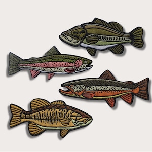 May include: Four embroidered iron-on patches of different fish species: a largemouth bass, a rainbow trout, a brown trout, and a smallmouth bass. The patches are all in a realistic style and feature detailed embroidery.