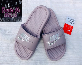 pink and purple nike slides