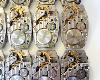 Juego de 6 piezas de mecanismos de reloj vintage rotos.