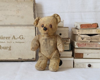 Antique straw filled teddy bear Small tattered animal without fur Primitive stuffed bear