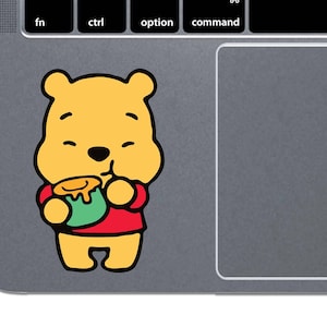 May include: A cartoon illustration of Winnie the Pooh holding a pot of honey. The illustration is in a simple, cartoon style with a yellow background.