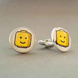 Gemelos cabeza de hombre Lego. Regalo único hecho a mano, disponible en baño de plata y oro y acabado en bronce antiguo.