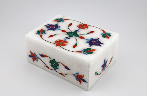 Real stone-on-stone Pietra Dura floral inlay work — an ancient Mughal/Italian craft technique that most people have never seen up close, let alone owned.