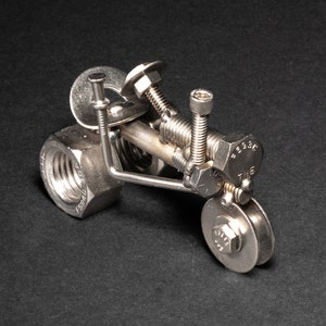 Handmade Scrap Metal Tractor Figurine: Nuts & Bolts Sculpture
