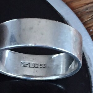 May include: Two silver rings with a 925S hallmark. The rings are stacked on top of each other.