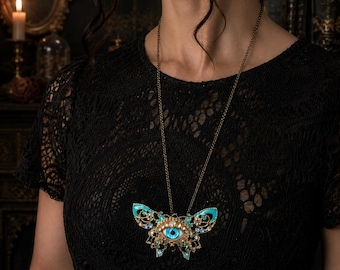 Surreal Evil Eye Butterfly Necklace | Blue Glass Eye Pendant