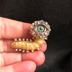 Hungry Little Caterpillar Golden Glitter Style Eyeball Art Brooch with a Natural Green Eye and Hand Placed Rhinestones! Eye Jewelry!