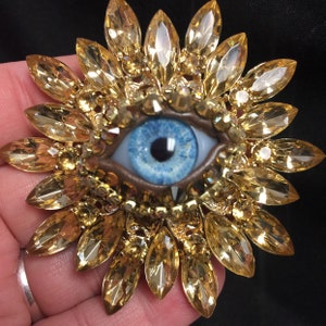 Golden Vintage Sunburst Style Eyeball Art Brooch with a Handmade Blue Glass Iris and Hand Placed Rhinestones!