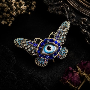 Surreal Evil Eye Butterfly Brooch | Blue Glass Eye Pin image 1