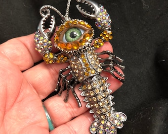 Quirky Whimsical Bejeweled Cray Fish or Lobster Eyeball Art Brooch with a Natural Green Eye and Hand Placed Rhinestones and a HINGED Tail!
