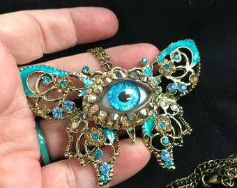 Bejeweled and Enameled Butterfly Eyeball Art Necklace with a Handmade Blue Glass Iris and Hand Placed Rhinestones!