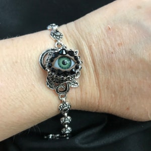 Antiqued Silver Tone Vintage Style Rose Eyeball Art Bracelet with a Natural Green Eye and Hand Placed Rhinestones! Art Deco Eye Jewelry!