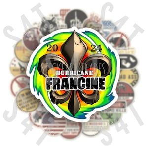 May include: A sticker featuring a fleur-de-lis design with the text "Hurricane Francine 2024". The design is in black, gold, and white, with a green and yellow swirl background. The sticker is surrounded by other stickers.