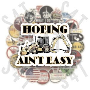 May include: A white and yellow excavator with a black "HOEIN' AINT' EASY" text sticker. The sticker is on a white background with a circle of other stickers around it.