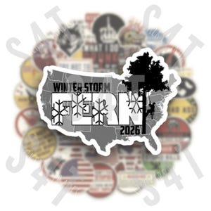 May include: A sticker featuring a gray outline of the United States with the words "WINTER STORM FERN 2026" and snowflake graphics. A black tree and a person climbing it are on the right side. Other stickers are in the background.