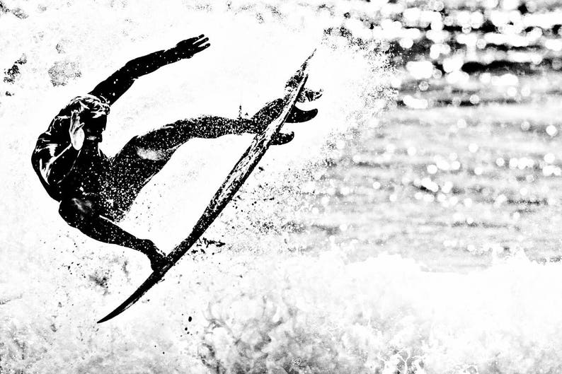 May include: A black and white silhouette of a surfer riding a wave on a surfboard.