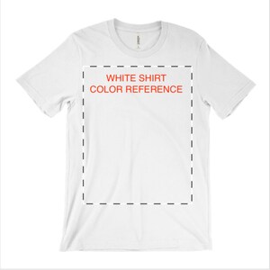 May include: White t-shirt with a black dashed line border around a white rectangle with the text "WHITE SHIRT COLOR REFERENCE" in red.