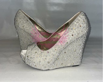 Pearl-encrusted ivory peep toe wedges