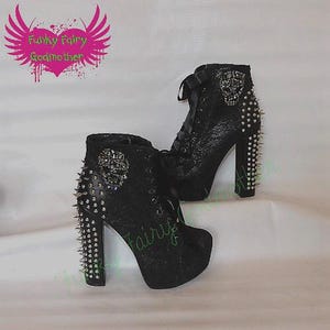 Black lace ankle boots with studs, spikes, and large  rhinestone skull