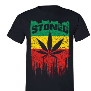 May include: Black t-shirt with a red, yellow, and green marijuana leaf design and the word "STONED" in white letters.
