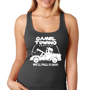 May include: A dark gray tank top with a white graphic of a camel driving a tow truck. The graphic says "Camel Towing Services" and "We'll pull it out!"