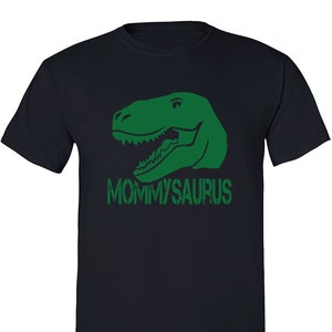 May include: A dark blue t-shirt with a green dinosaur head graphic and the text "Mommyaurus" in green.