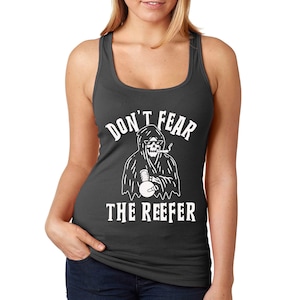 May include: A dark grey tank top with a white graphic of a skeleton wearing a hooded robe and smoking a pipe. The text "Don't Fear The Reefer" is printed below the graphic.