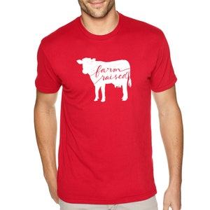 May include: Red t-shirt with a white silhouette of a cow and the text "farm raised" in red.