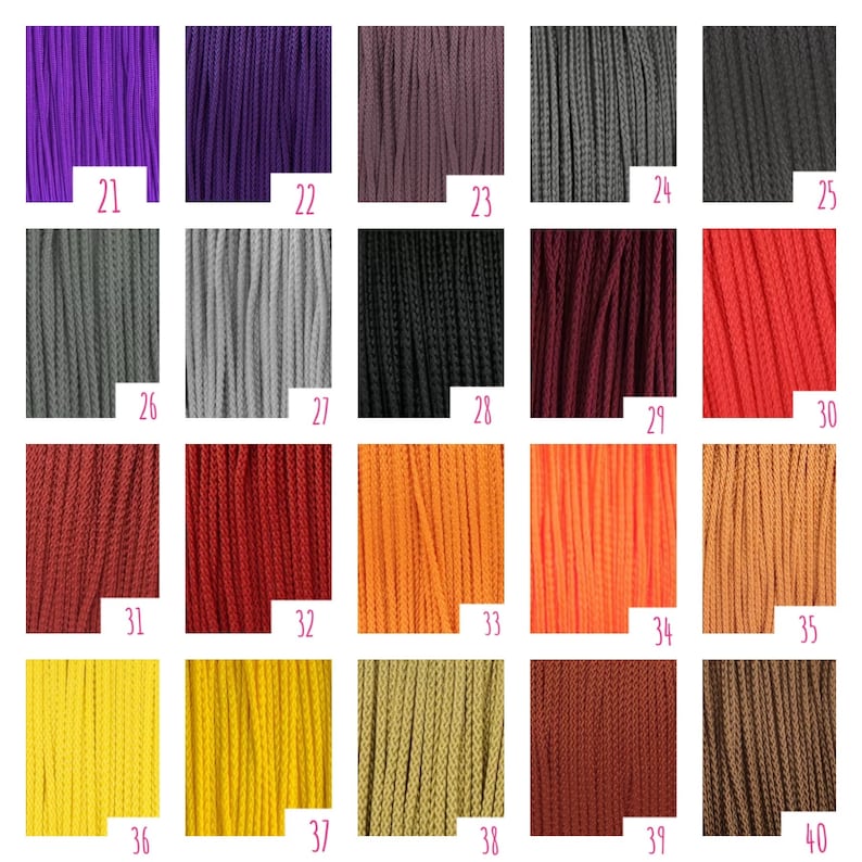 May include: A grid of twenty vertical cord samples labeled 21 through 40, displaying a spectrum of colors including purple, gray, black, red, orange, yellow, and brown. Each section shows the texture of the braided cord material clearly.