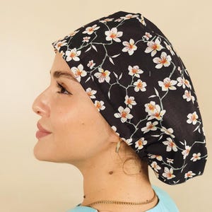 Custom Scrub Cap Professional Medical Headwear Cotton Fabric Construction Personalized Embroidery Options Button Mask Attachments Comfortable Satin Lined Design Hospital Staff Essential Surgical Cap Scrub Hat for Nurse Surgical Cap Adjustable with elastic band holding a big amount of hair Scrub Caps For Women Fun Colorful With Animals and Floral Print on the cotton.