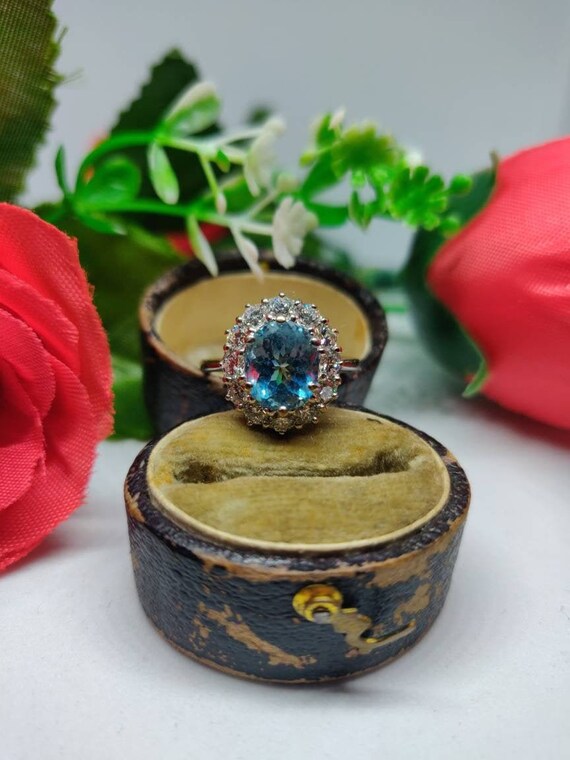18ct Gold Aquamarine and Diamond Cluster Ring. UK