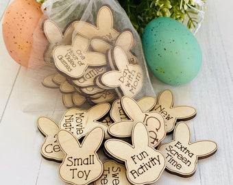 May include: A white mesh bag filled with wooden bunny-shaped tokens. Each token has a different activity written on it, such as "One Hour of Video Games", "Movie Night", "Sweet Treat", and "Fun Activity".