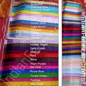May include: A display of colorful fabric swatches in various shades, including green, blue, purple, and red. The swatches are labeled with color names like "Pea Green," "Burgundy," and "Royal Blue." The image also includes the text "IndianFabricsnCrafts."