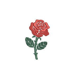 May include: Embroidered red rose with green stem and leaves on a white background. The rose is in full bloom, with detailed stitching creating a textured appearance. The leaves are a deep green, and the stem is a lighter green.