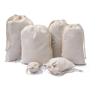 May include: Set of six natural cotton drawstring bags in various sizes. The bags are made of a soft, natural fabric and have a simple, elegant design.