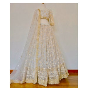 white and gold pakistani wedding dress