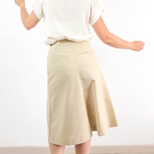 The 70s mod a line skirt is Polyester and Rayon fabric in excellent vintage conditions, by Jaeger (Made in UK).