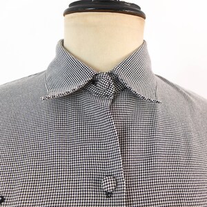 May include: A white and black gingham button-down shirt with a pointed collar.
