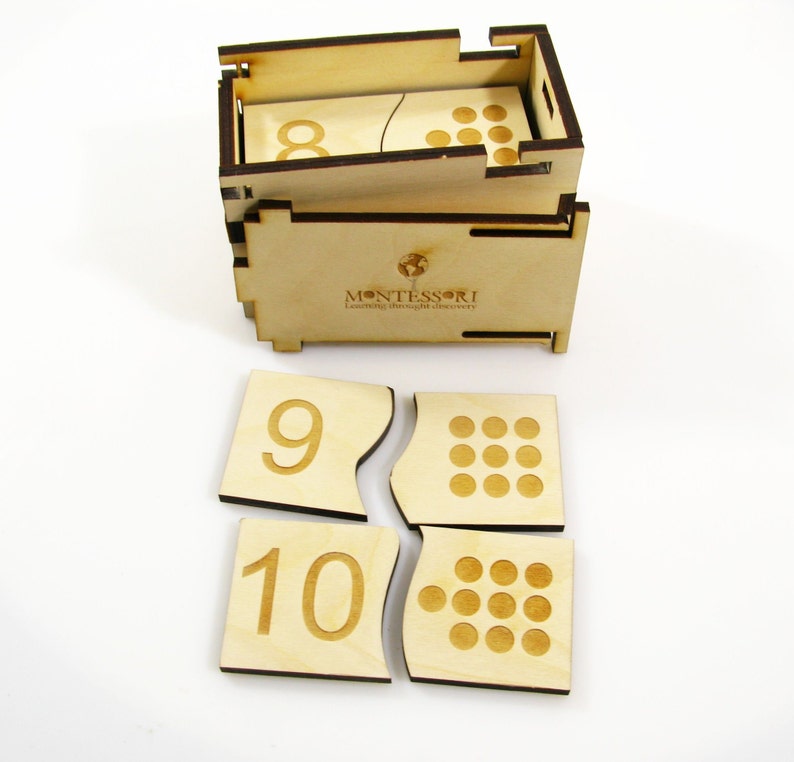 May include: Wooden Montessori number puzzle with a box. The puzzle pieces show the numbers 8, 9, and 10 with corresponding dots. The box has the text "MONTESSORI Learning through delightful discovery" printed on it.