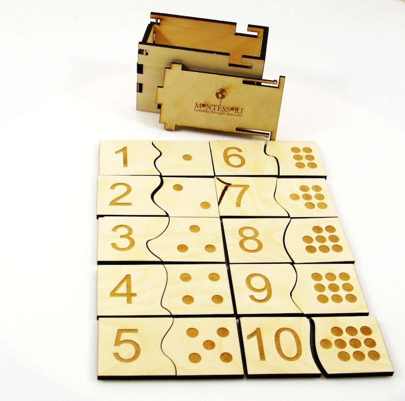 May include: Wooden Montessori puzzle with numbers 1 through 10 and corresponding dots. The puzzle pieces are arranged in a grid pattern and fit together to form a complete picture. The puzzle comes with a wooden box for storage.
