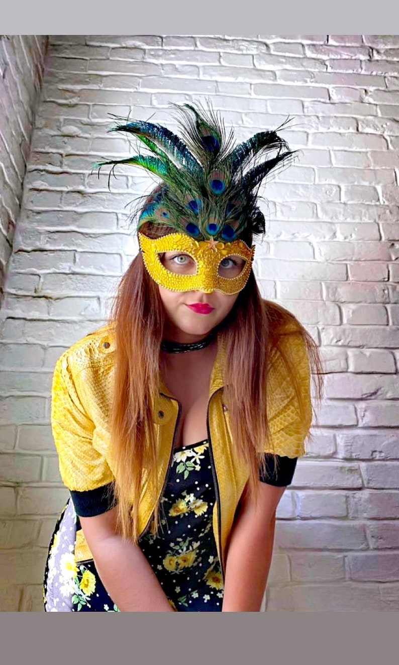 Peacock feathers mask with yellow rhinestones