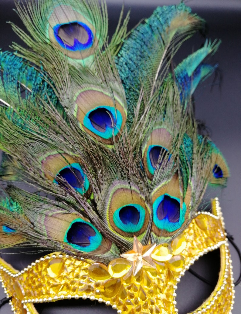 Peacock feathers mask with yellow rhinestones