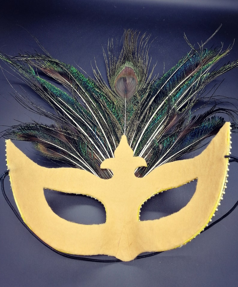Peacock feathers mask with yellow rhinestones