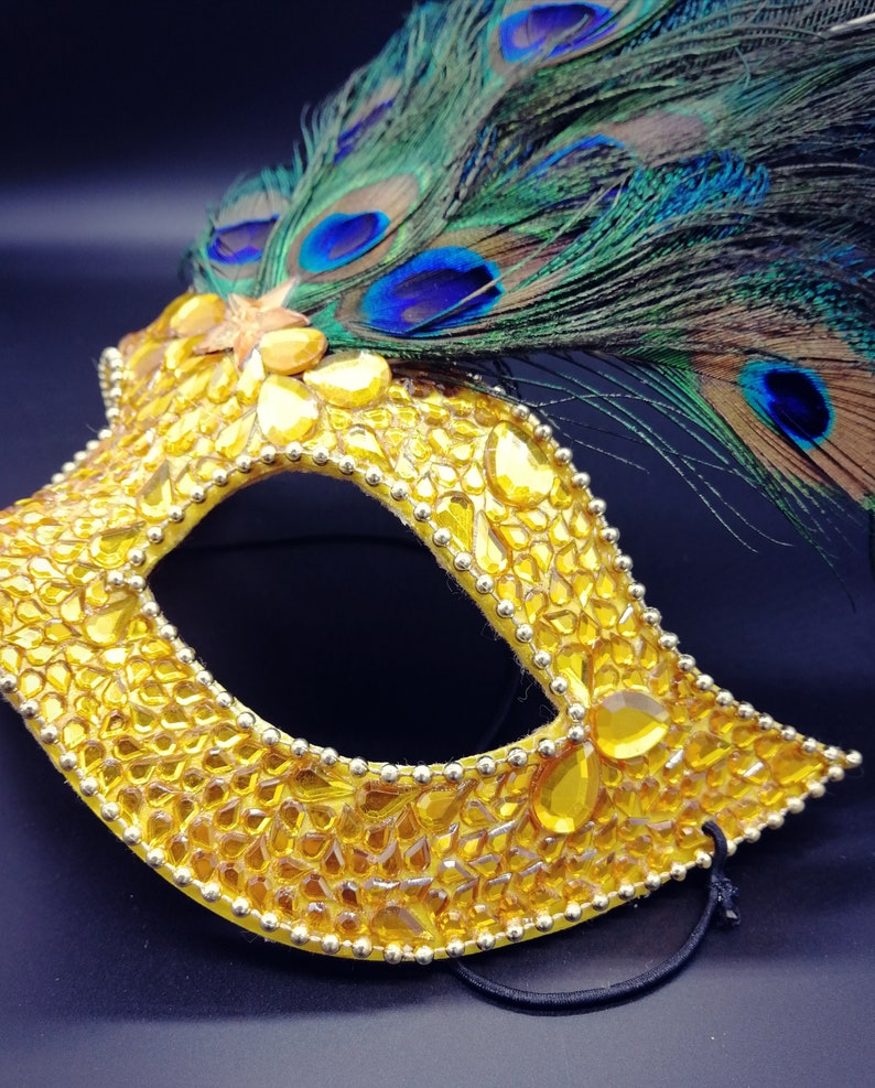 Peacock feathers mask with yellow rhinestones