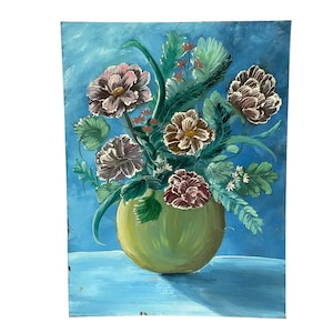 May include: A painting of a bouquet of flowers in a green vase. The flowers are pink, white, and yellow, and the vase is on a blue table.