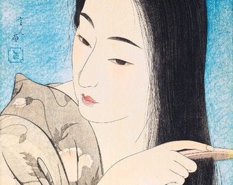 May include: A woman with long black hair is brushing her hair with a comb. She is wearing a light gray kimono with a floral pattern. The background is a light blue color.