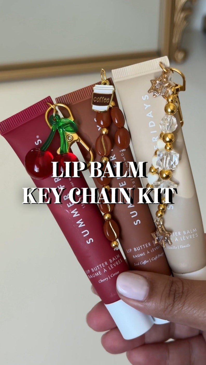 May include: Three lip balm tubes with keychains. The lip balms are labelled "Summer", "Summer", and "Fridays". The keychains are a cherry, a coffee cup, and a star.