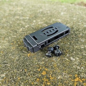 May include: Black plastic knife sheath with two black screws.