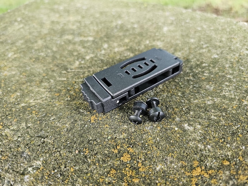 May include: Black plastic knife sheath with two black screws.